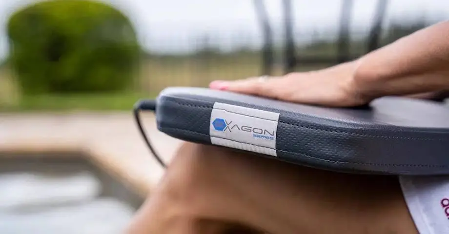 A person holding an electronic device in their hand.